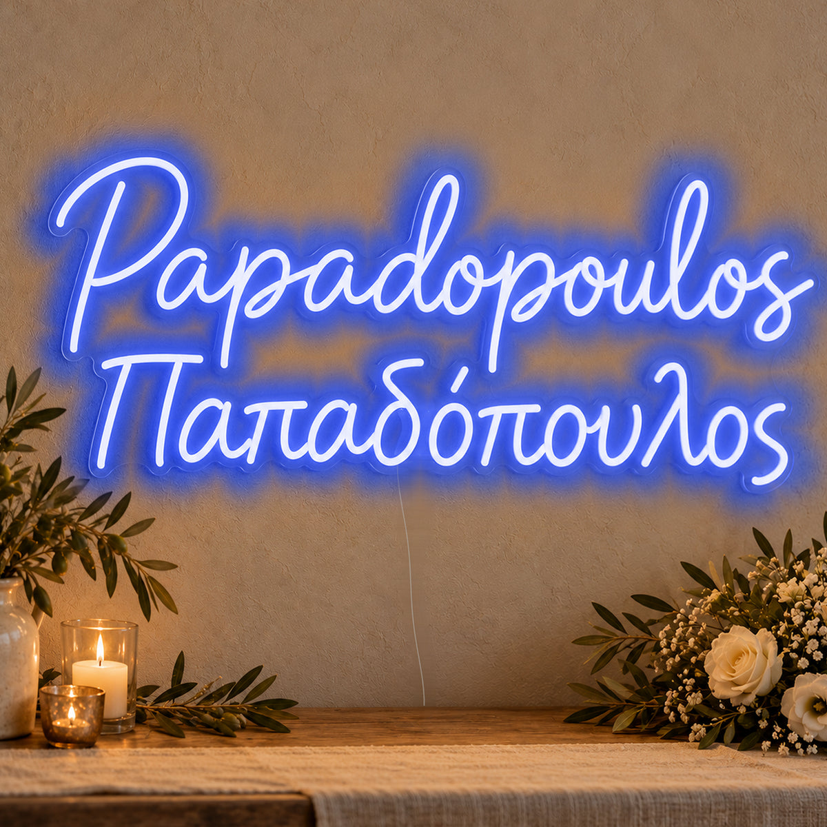Personalised Bilingual Greek Surname Neon Sign in blue LED neon on clear acrylic, angled view