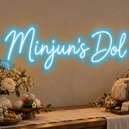 Personalised Dol Neon Sign in ice blue LED neon on clear acrylic, angled view
