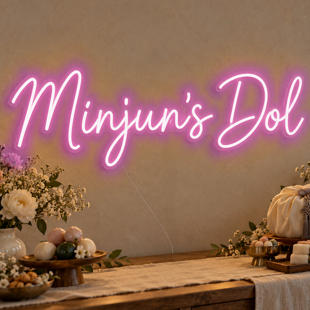 Personalised Dol Neon Sign in pink LED neon on clear acrylic, angled view