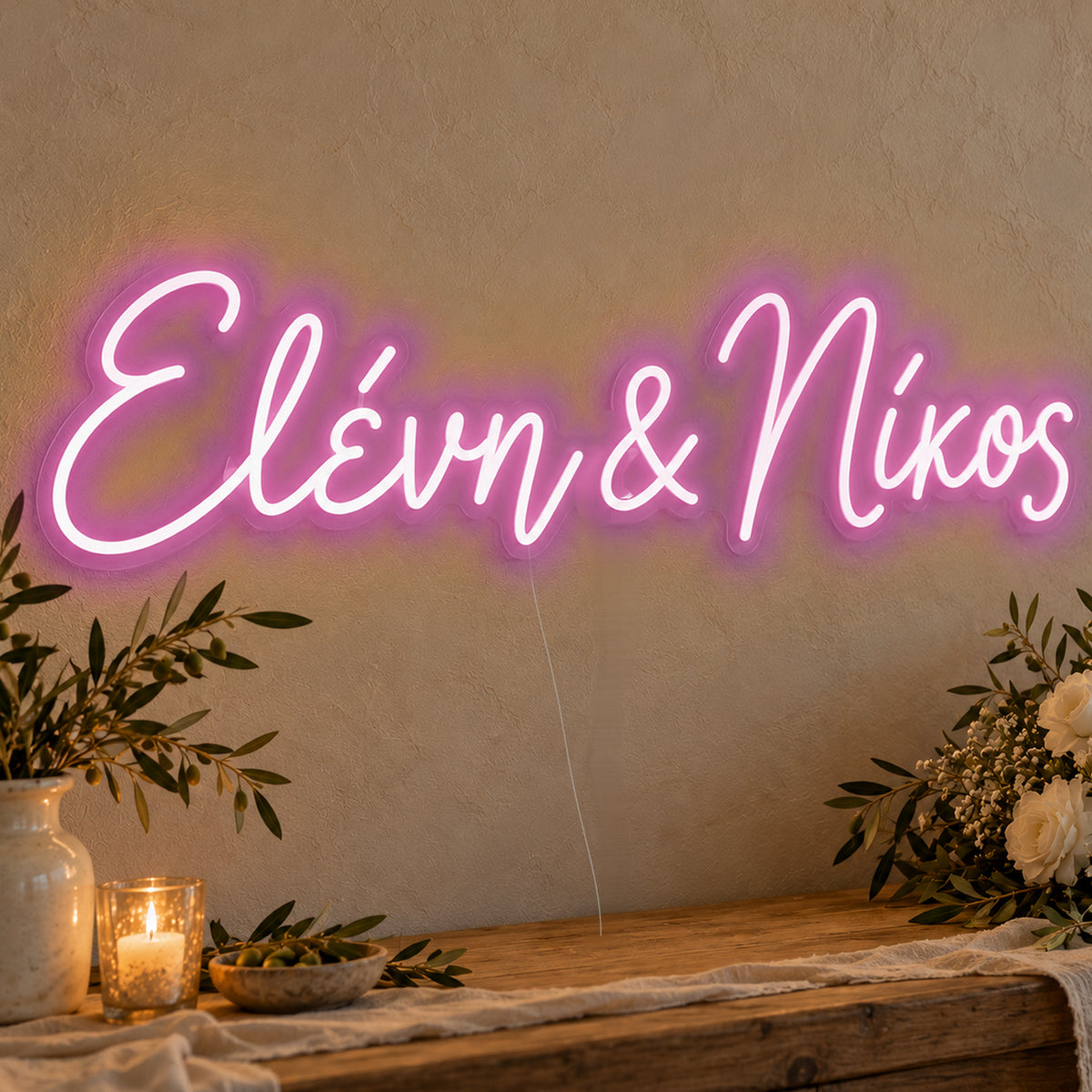 Personalised Greek Couple Names Neon Sign in pink LED neon on clear acrylic, angled view
