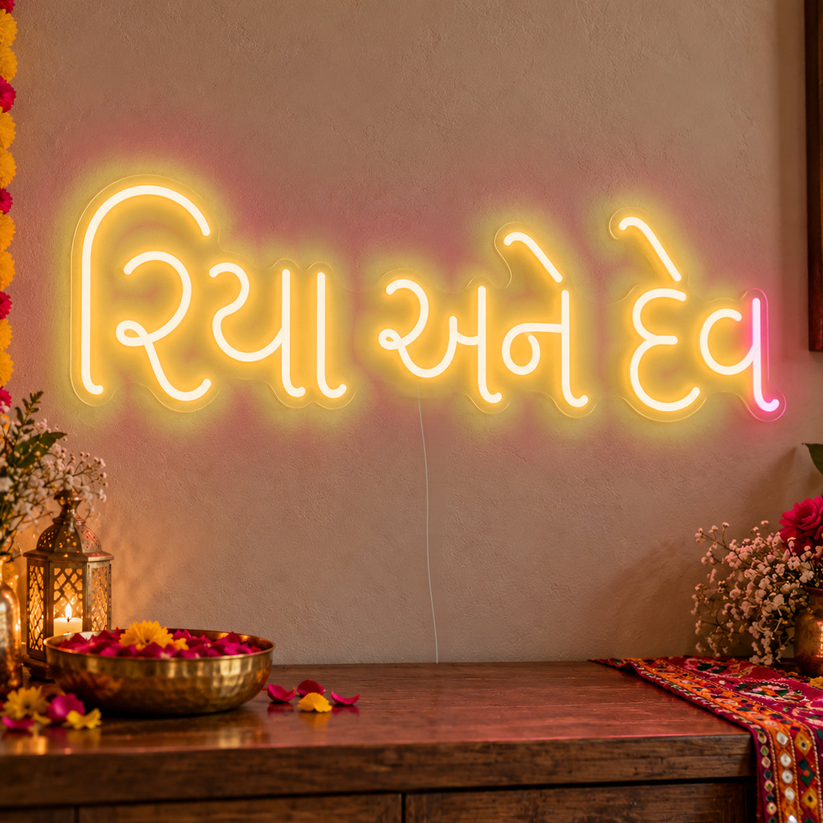 Personalised Gujarati Couple Names Neon Sign in gold LED neon on clear acrylic, angled view