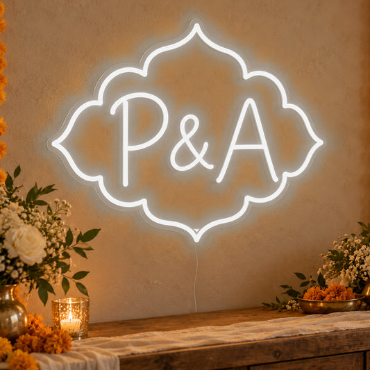 Personalised Marigold Initials Neon Sign in white LED neon on clear acrylic, angled view