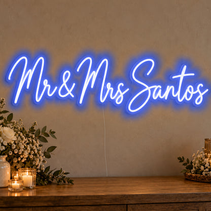 Personalised Mr & Mrs Surname Neon Sign in blue LED neon on clear acrylic, angled view