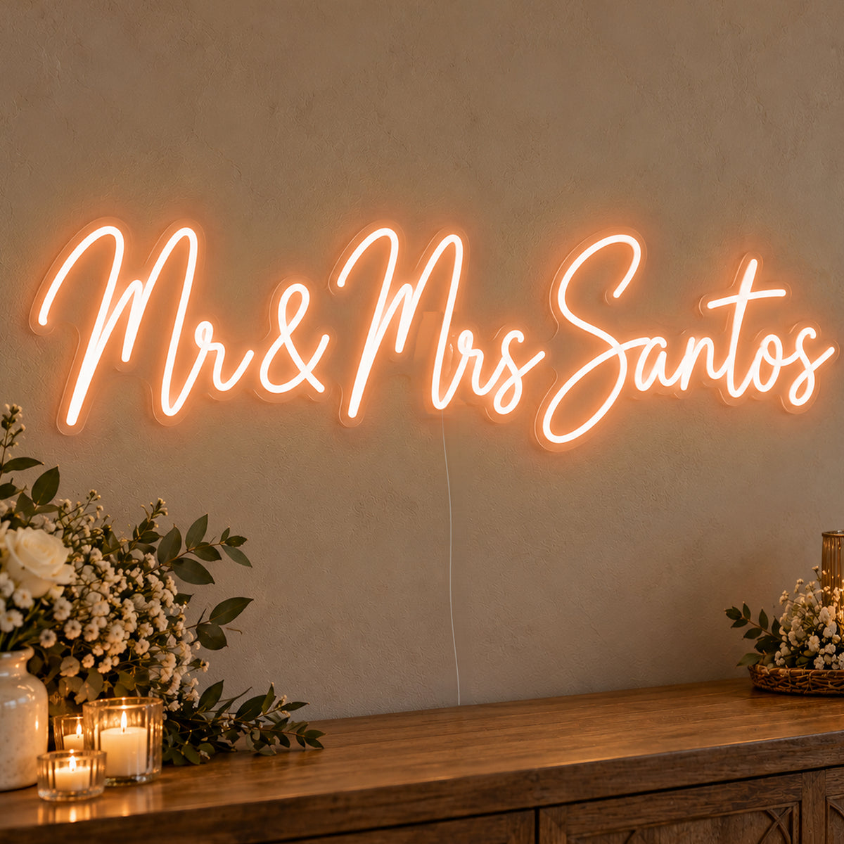 Personalised Mr & Mrs Surname Neon Sign in orange LED neon on clear acrylic, angled view