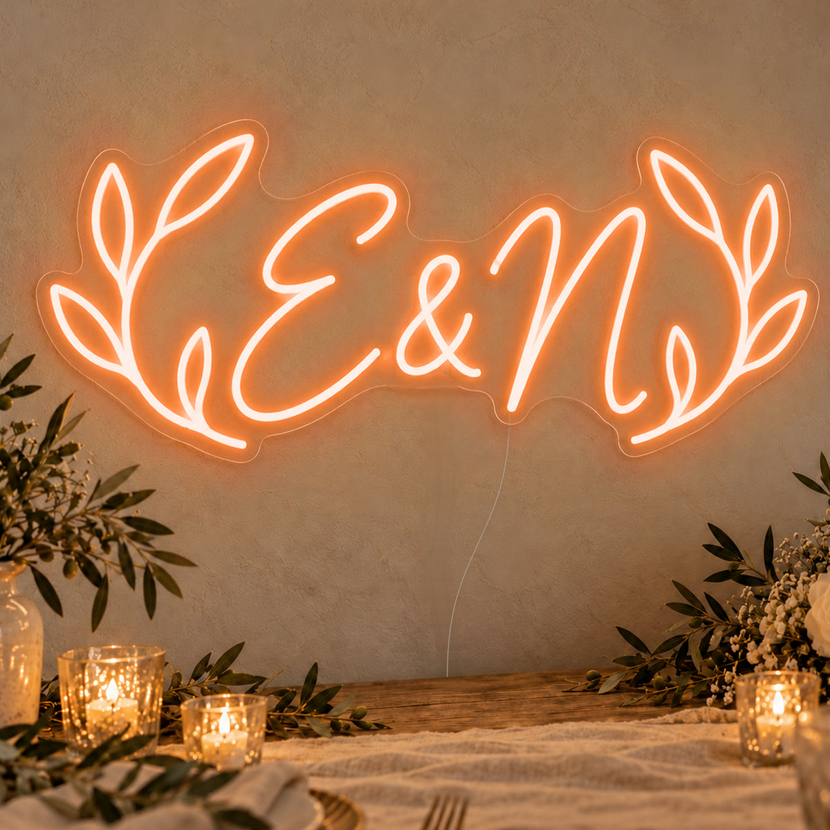 Personalised Olive Initials Neon Sign in orange LED neon on clear acrylic, angled view