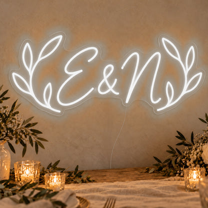 Personalised Olive Initials Neon Sign in white LED neon on clear acrylic, angled view