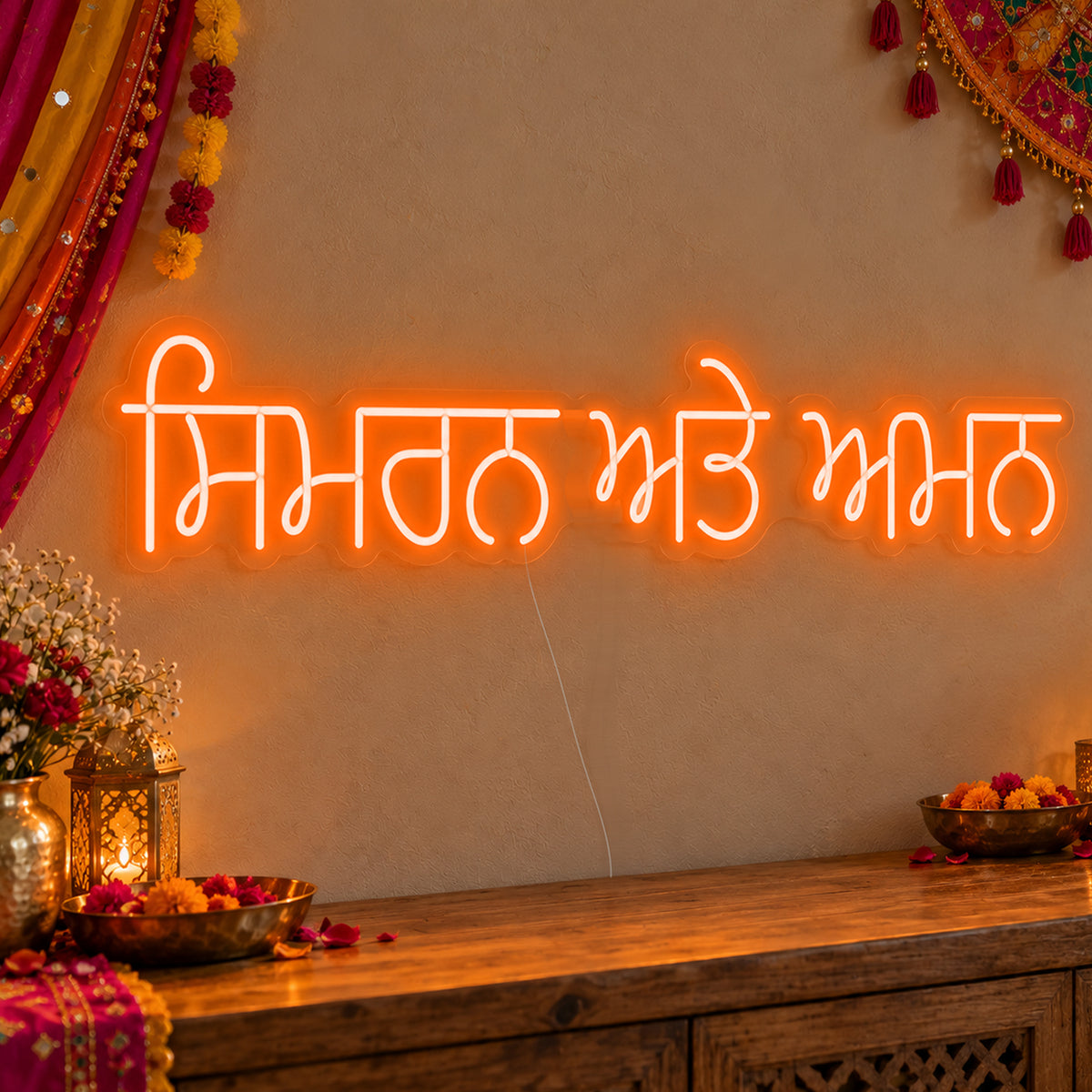 Personalised Punjabi Couple Names Neon Sign in orange LED neon on clear acrylic, angled view