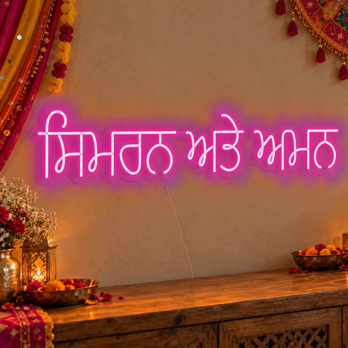 Personalised Punjabi Couple Names Neon Sign in pink LED neon on clear acrylic, angled view