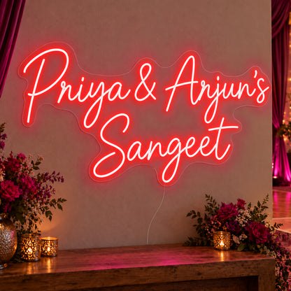 Personalised Sangeet Neon Sign in red LED neon on clear acrylic, angled view