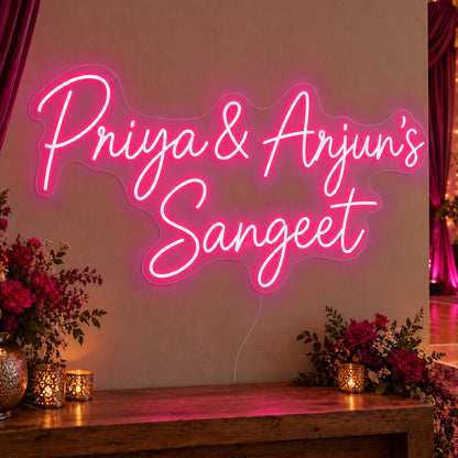 Personalised Sangeet Neon Sign in rose red LED neon on clear acrylic, angled view