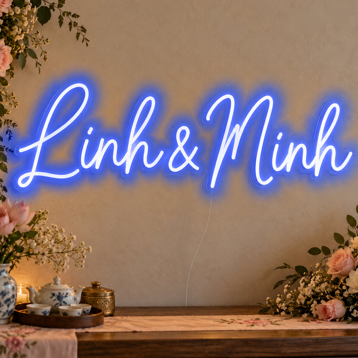 Personalised Vietnamese Couple Names Neon Sign in blue LED neon on clear acrylic, angled view