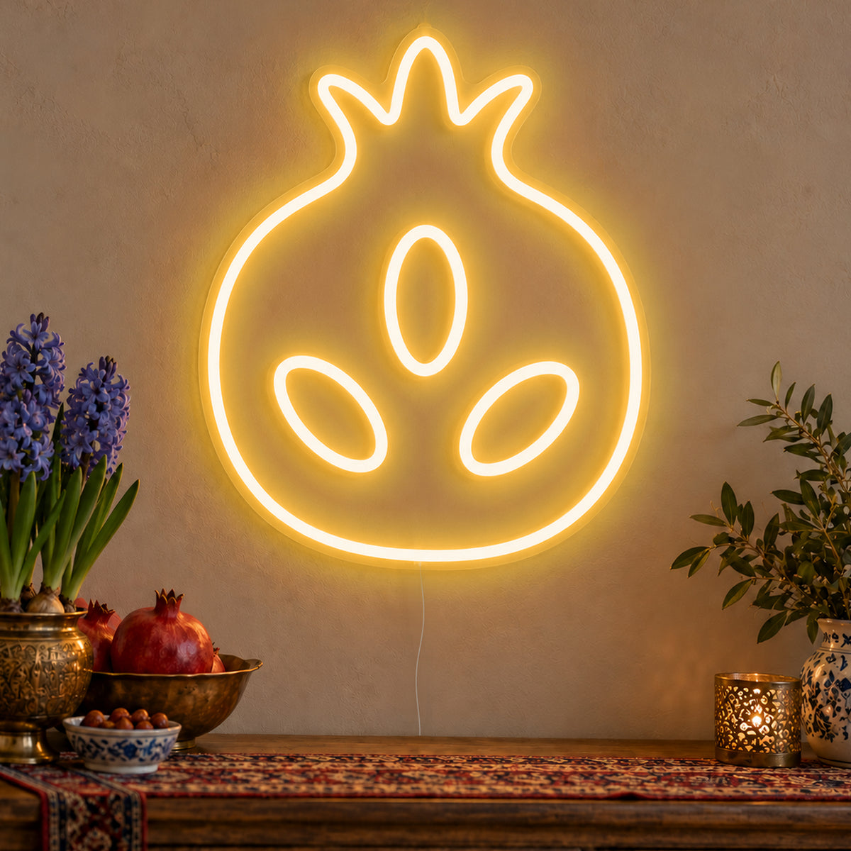 Pomegranate Neon Sign in gold LED neon on clear acrylic, angled view