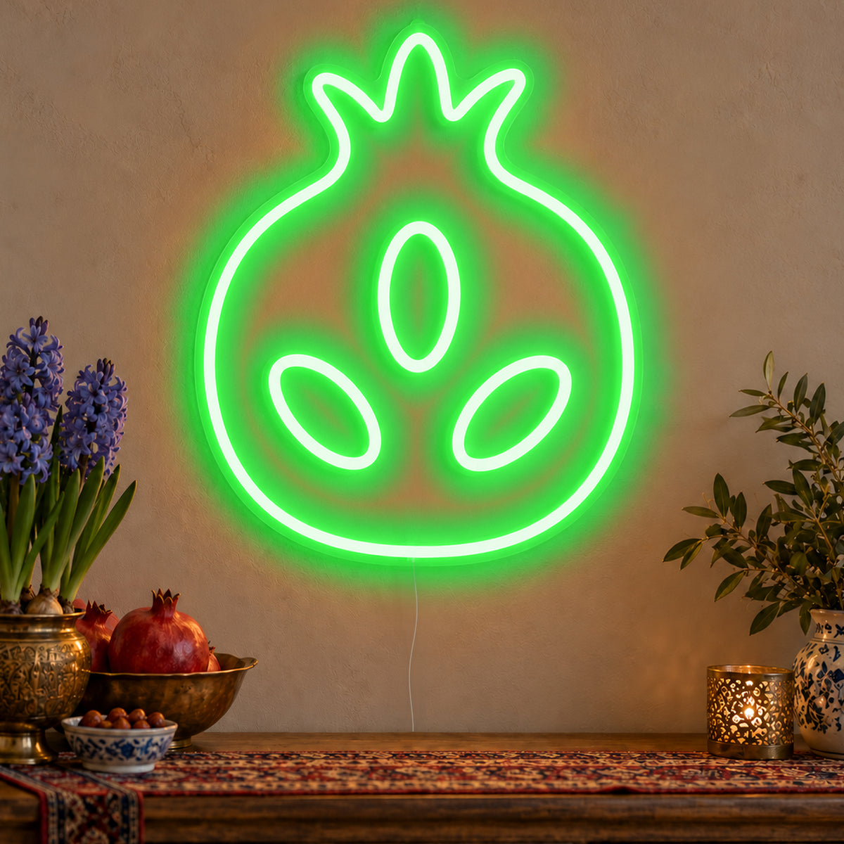 Pomegranate Neon Sign in green LED neon on clear acrylic, angled view