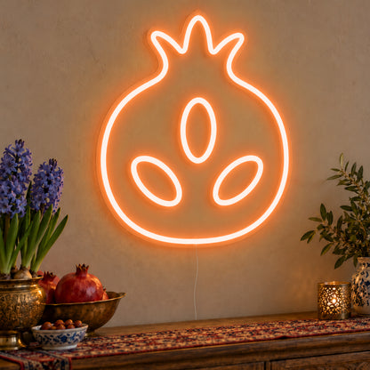 Pomegranate Neon Sign in orange LED neon on clear acrylic, angled view