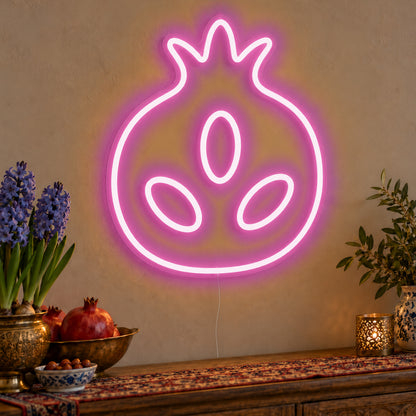 Pomegranate Neon Sign in pink LED neon on clear acrylic, angled view