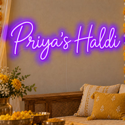 Personalised Haldi Neon Sign in purple LED neon on clear acrylic, angled view