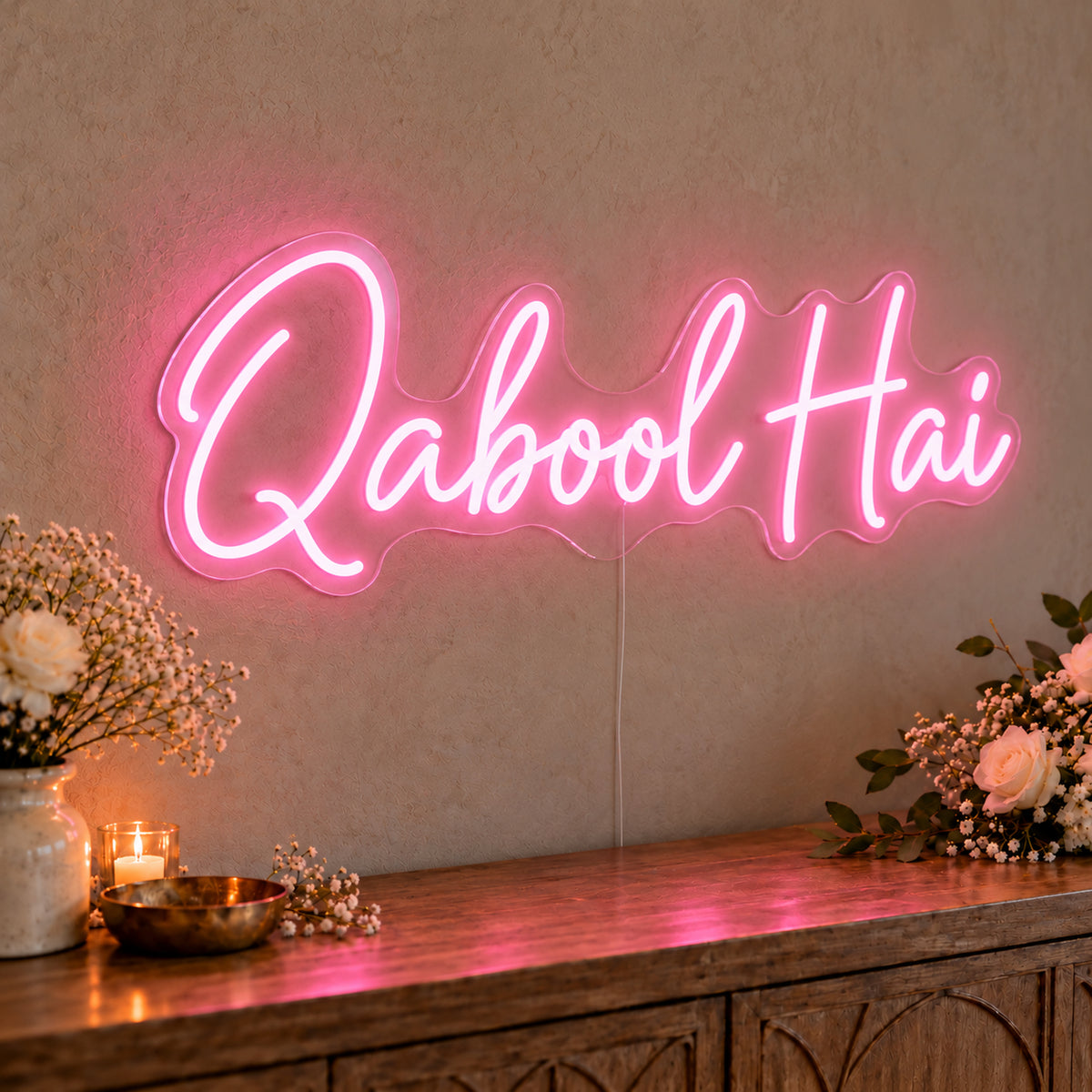 Qabool Hai Neon Sign in pink LED neon on clear acrylic, angled view