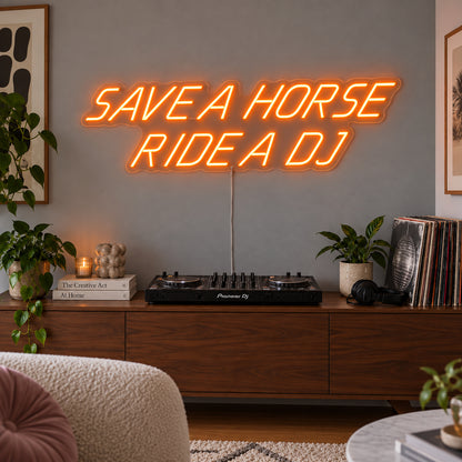 Orange version of the Save A Horse Ride A DJ Neon Sign, shown above a turntable on a wooden sideboard.