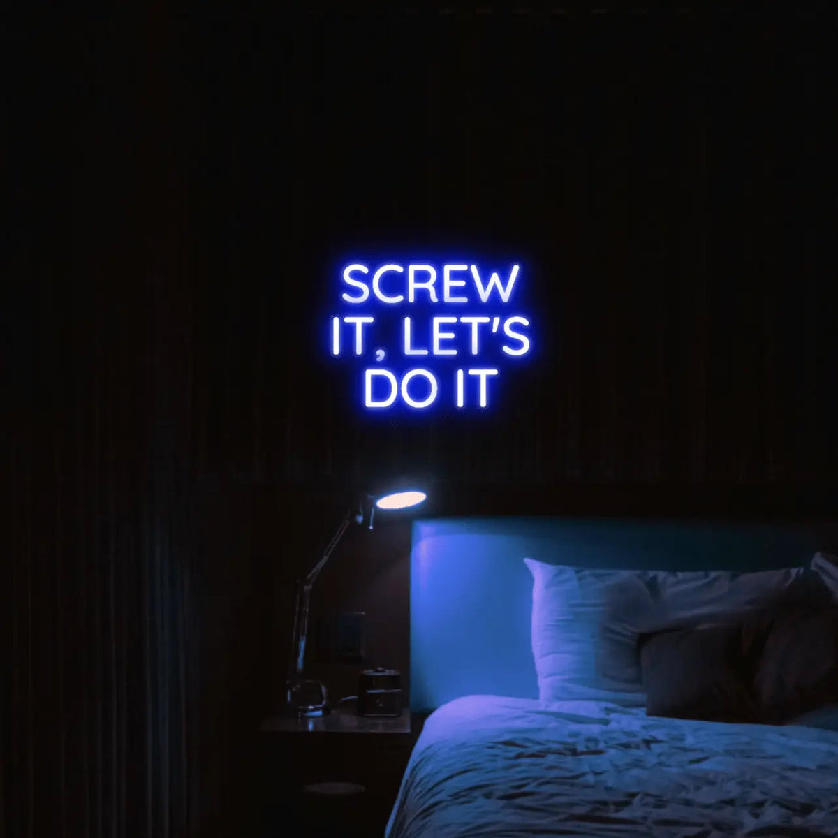 Screw It, Let's Do It LED Neon Light Sign in blue, featuring stacked block lettering illuminated above a bed.