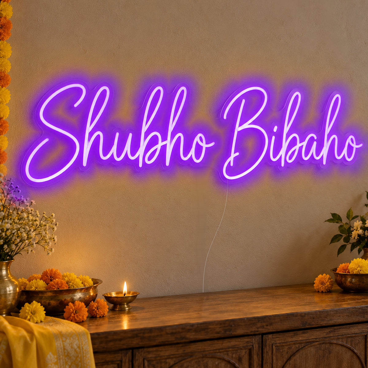 Shubho Bibaho Neon Sign in purple LED neon on clear acrylic, angled view