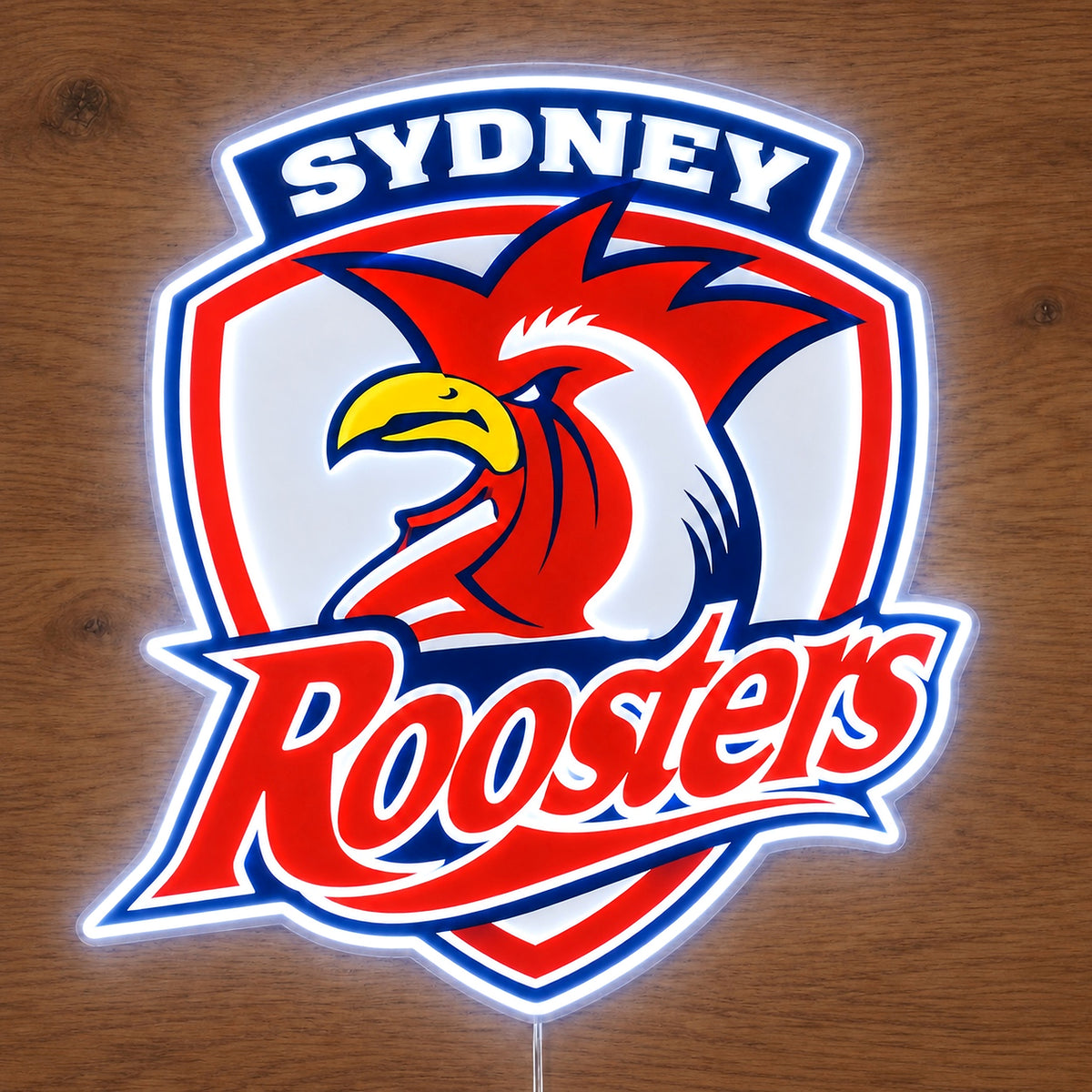 Sydney Roosters Neon Sign, featuring illuminated team logo on a wooden surface.
